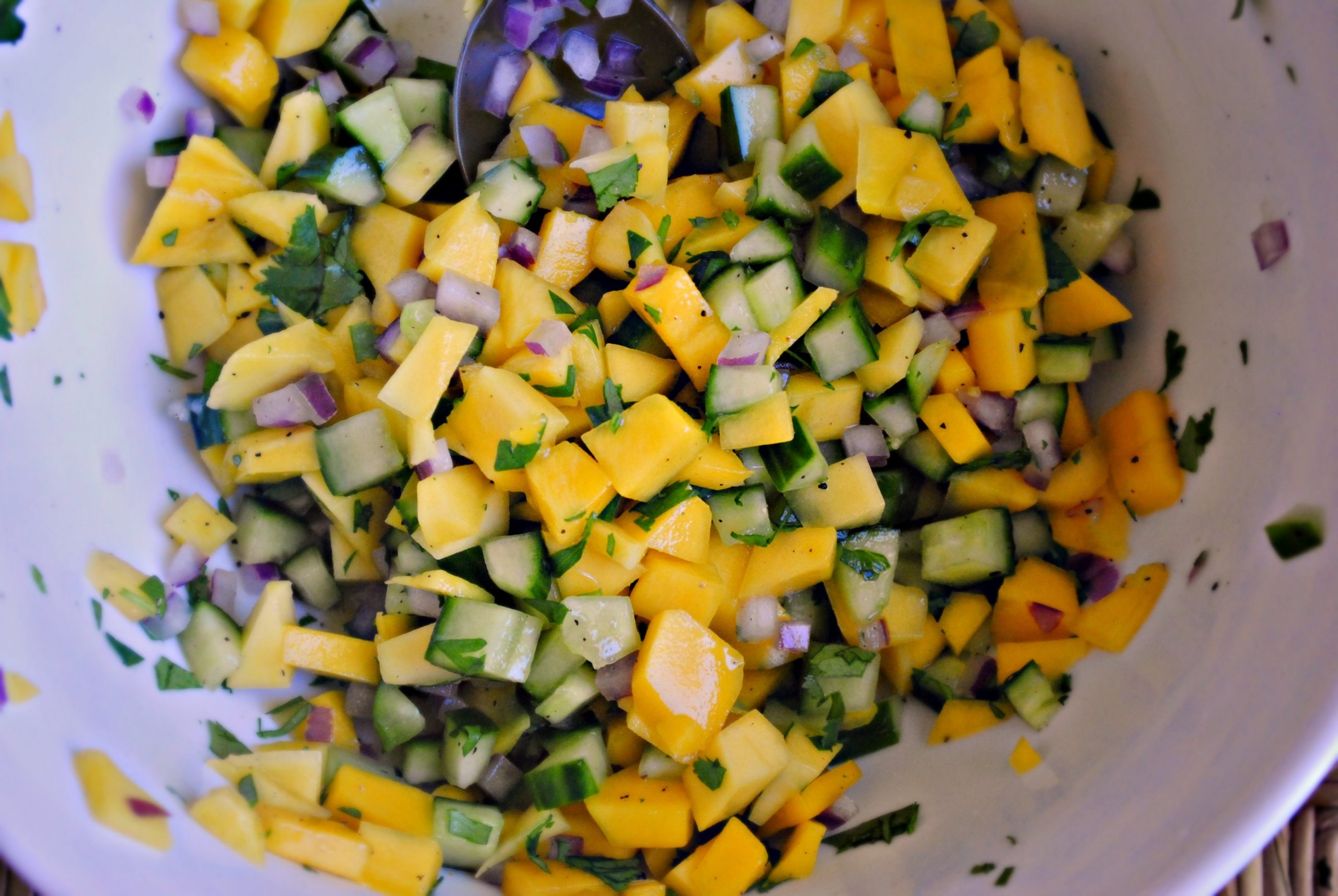 Fresh and bursting with flavor, this <b>Mango</b> Cucumber Salsa can be served wit...