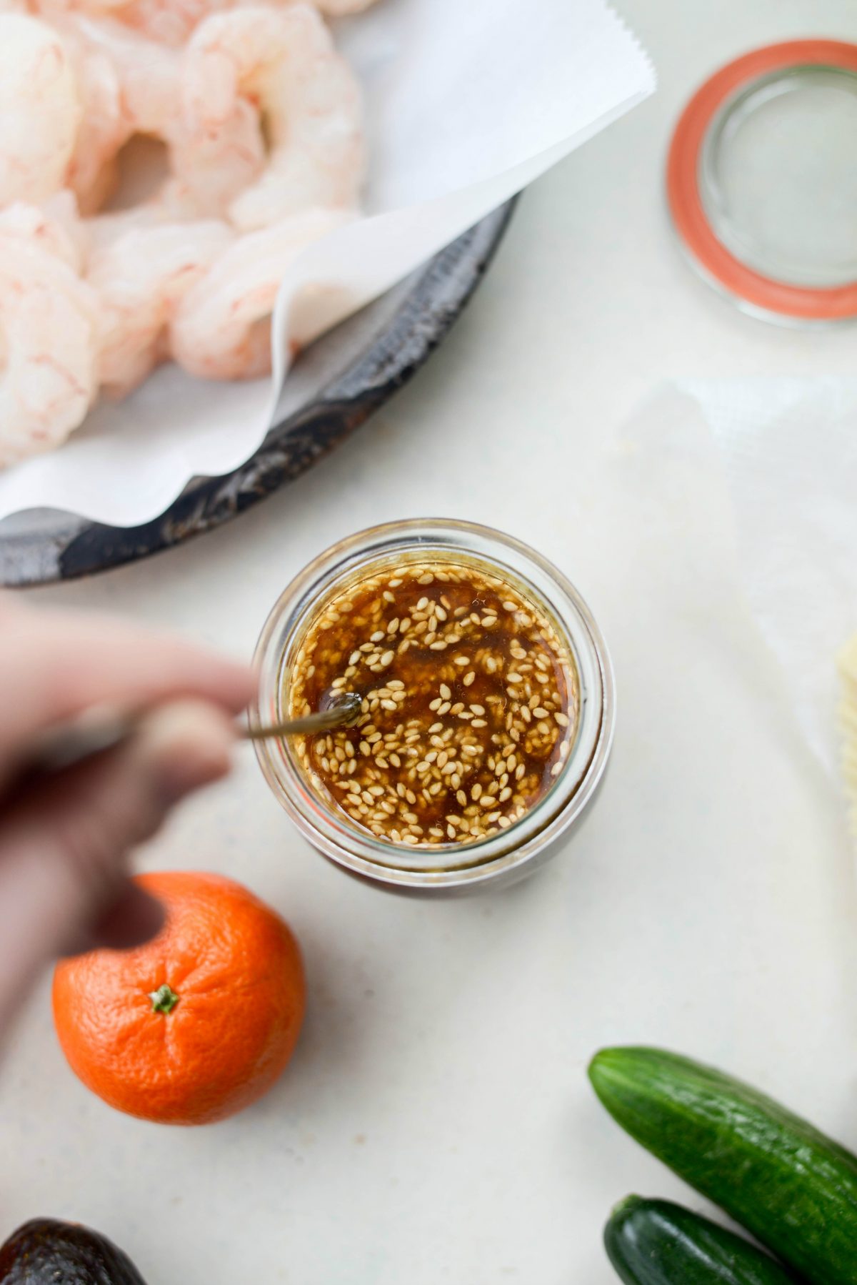 Stirring toasted sesame vinaigrette