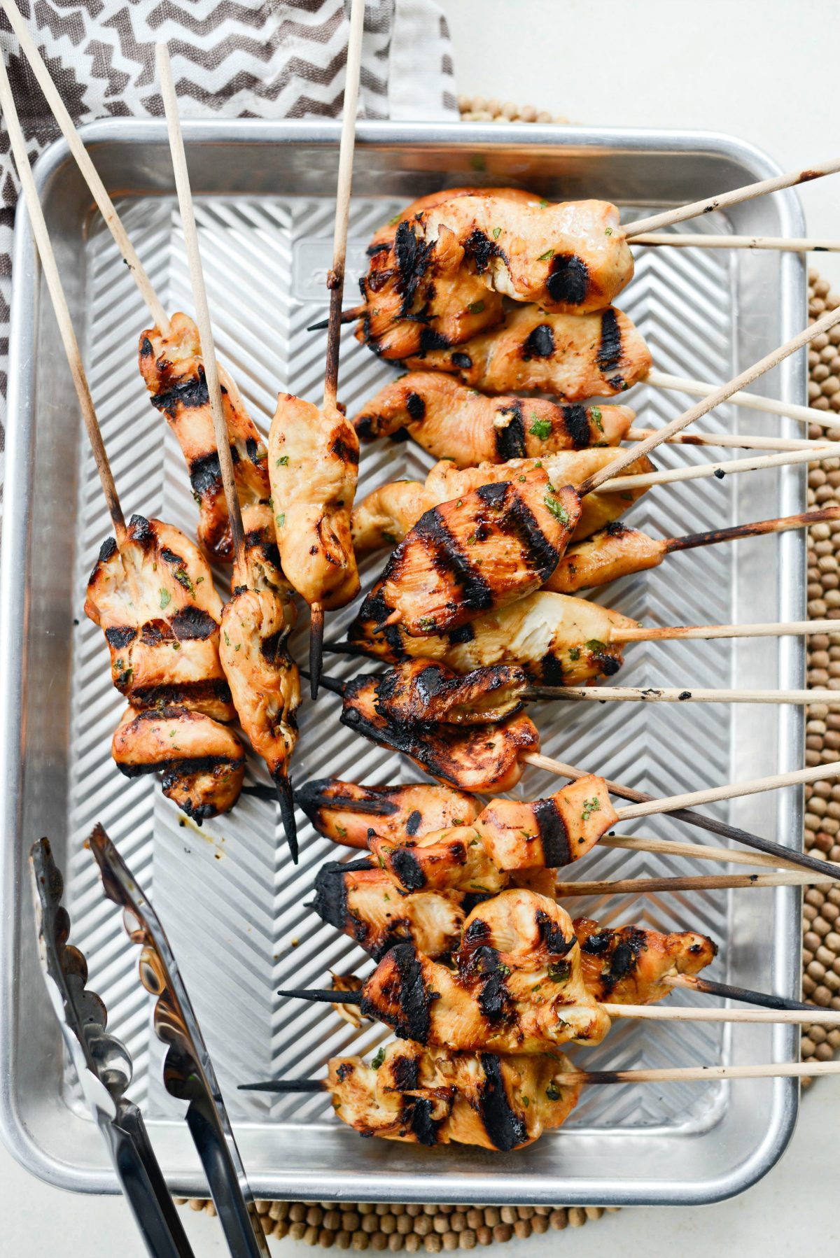 grilled thai chicken skewers on pan