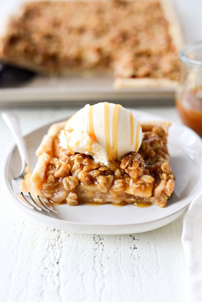 close up of Caramel Apple Slab Pie with ice cream and caramel sauce