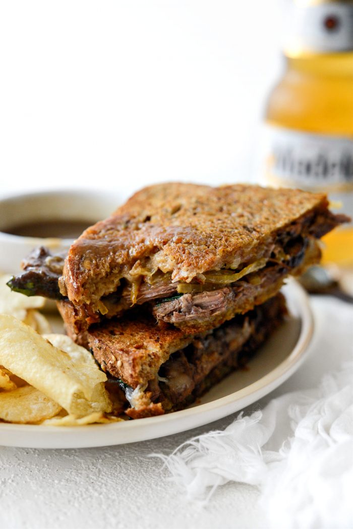 bite missing from Leftover Pot Roast Cheddar Grilled Cheese Sandwich