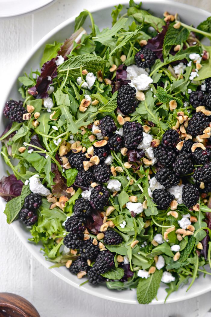 greens topped with blackberries, toasted hazelnuts and goat cheese