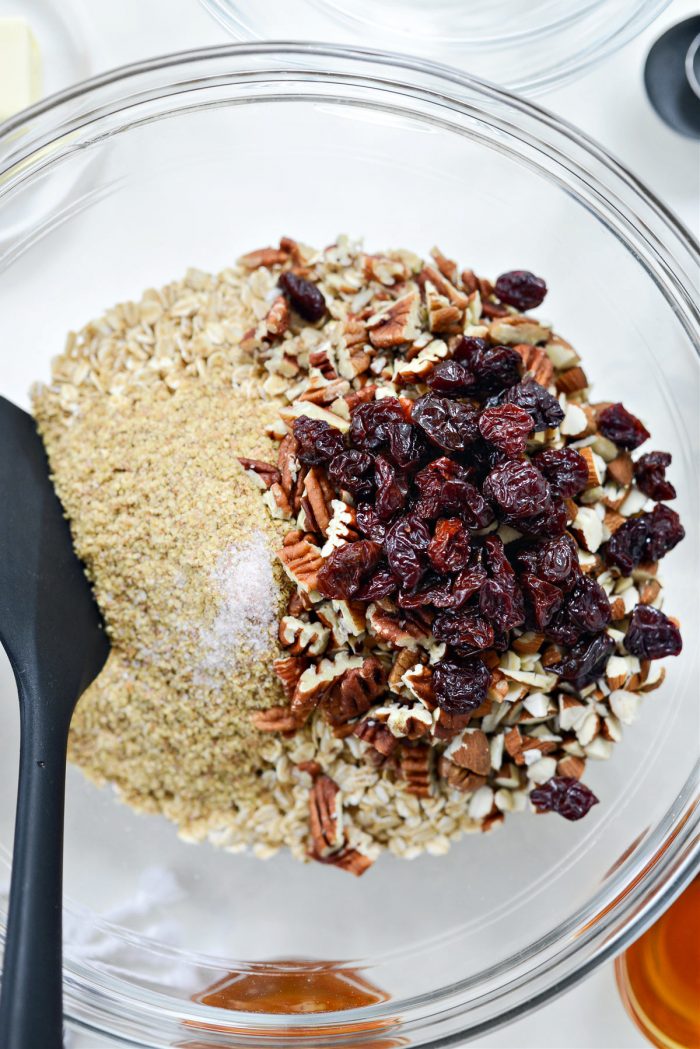 oats, wheat germ, salt, dried cherries and nuts in bowl