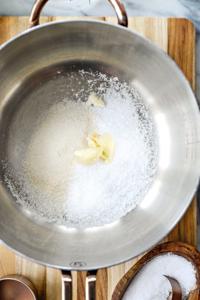 add sugar, salt and garlic to saucepan