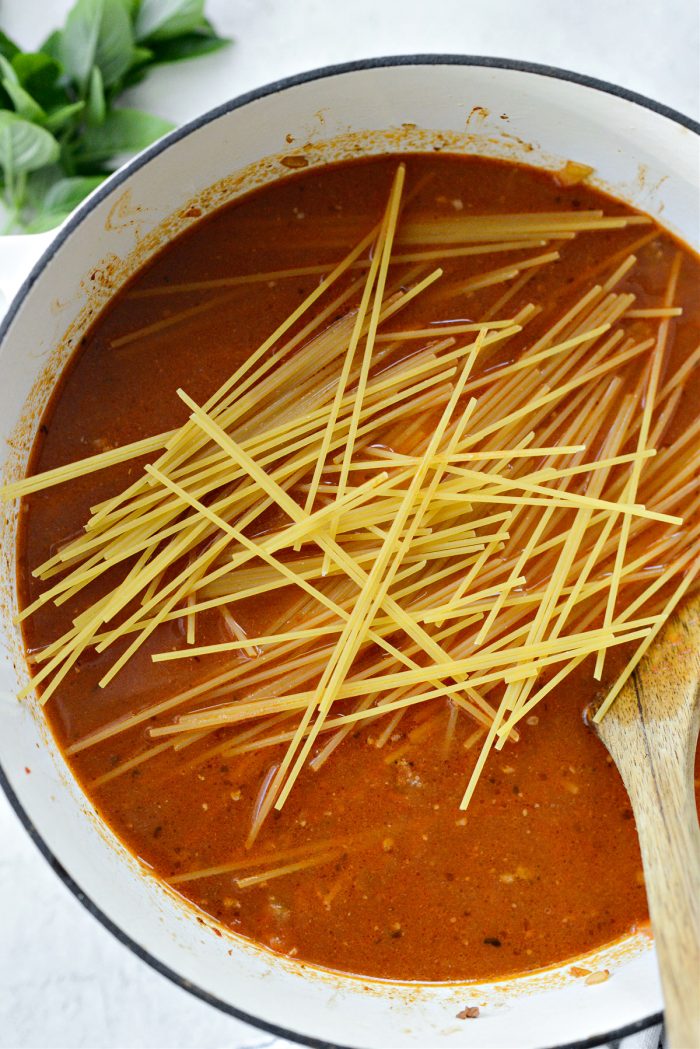 break spaghetti noodles in half and add to pot