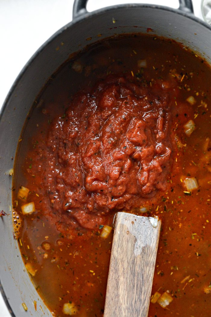 add broth and crushed fire roasted tomatoes