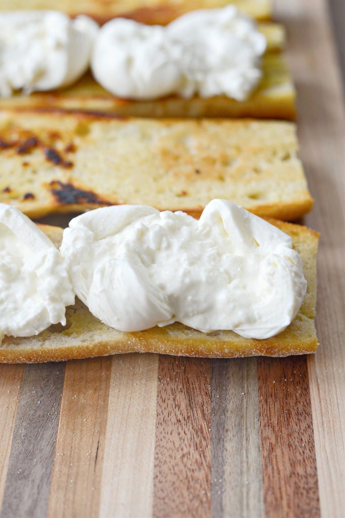 top bottom half with burrata, cut it open and spread.