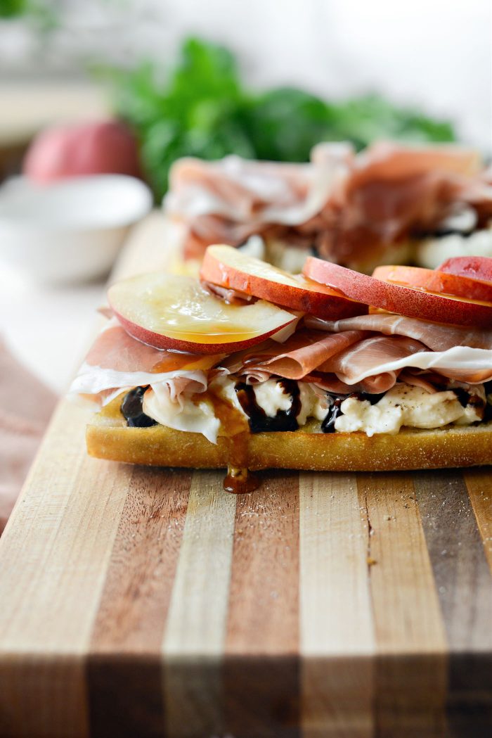 top the prosciutto with sliced peaches and drizzle of hot honey