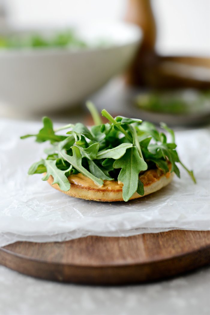 toasted English muffin with spicy mayo and arugula