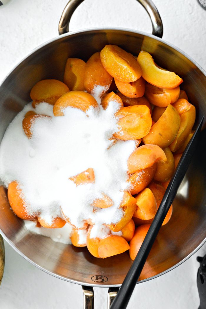 add apricots, lemon and sugar to a saucepan
