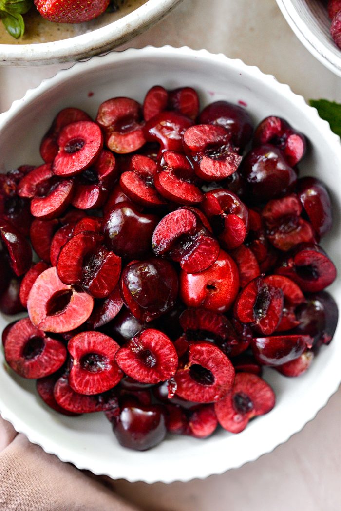 bowl of halved pitted cherries