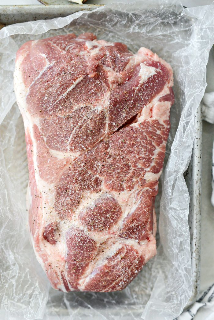 season pork shoulder with salt and pepper