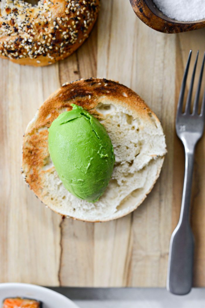 toast bagel and add avocado