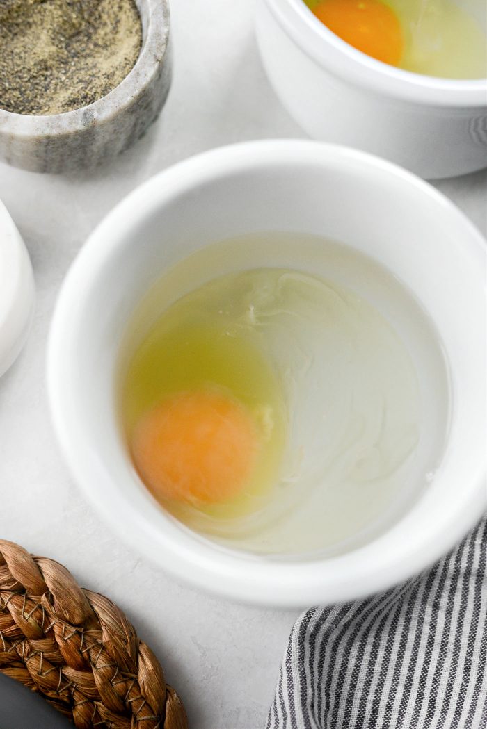 add remaining water and egg to second ramekin