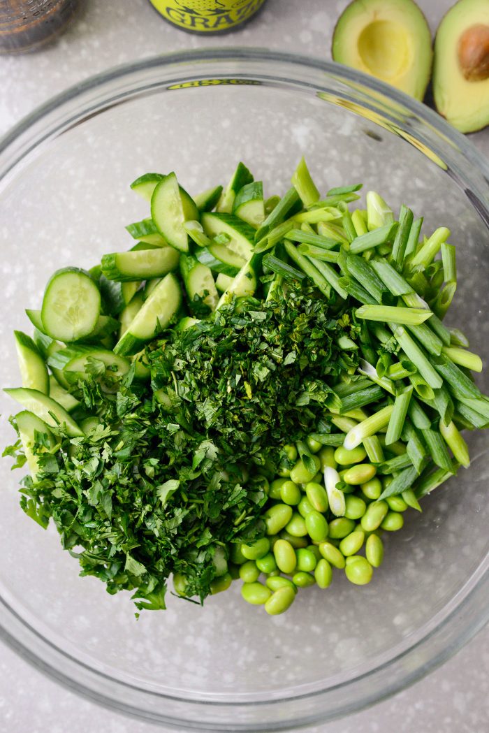 add veggies and herbs to the bowl