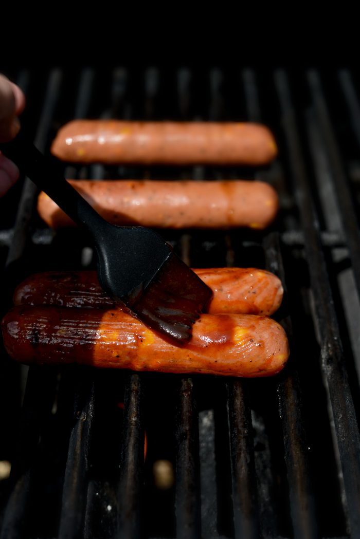 grill and brush brats with bbq sauce