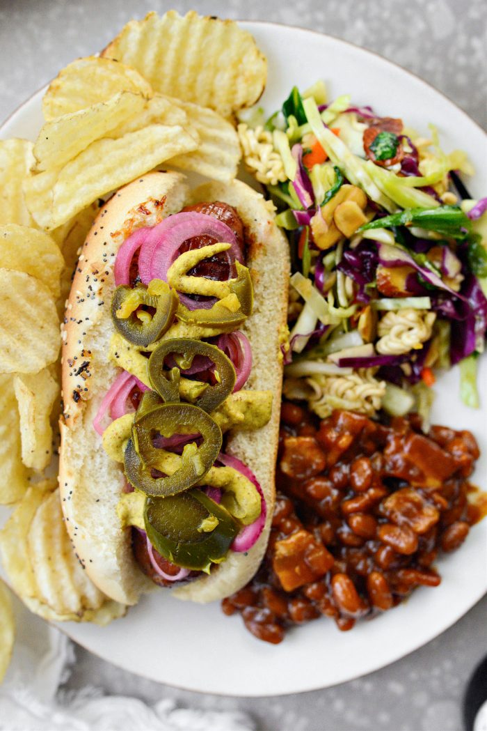 plate with Grilled BBQ Sauce Chicken Brats and sides