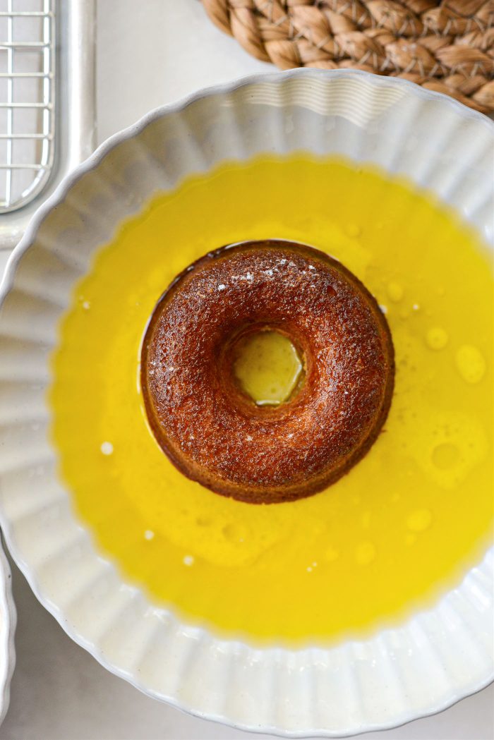 dip both sides of each of the doughnuts in butter