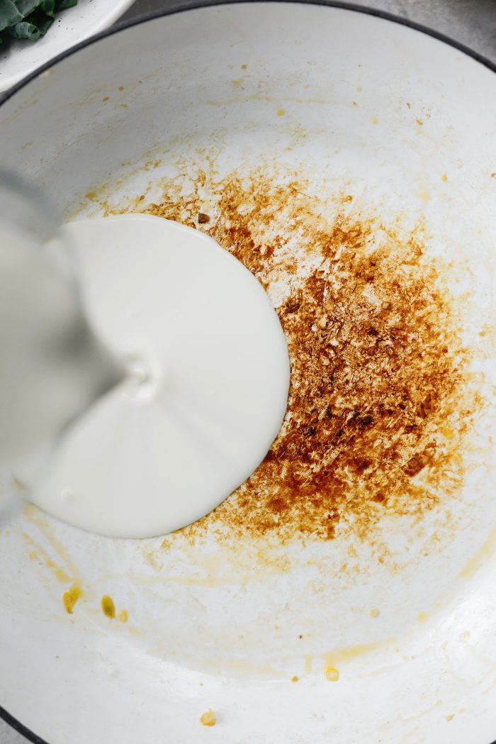 pour heavy cream into pan