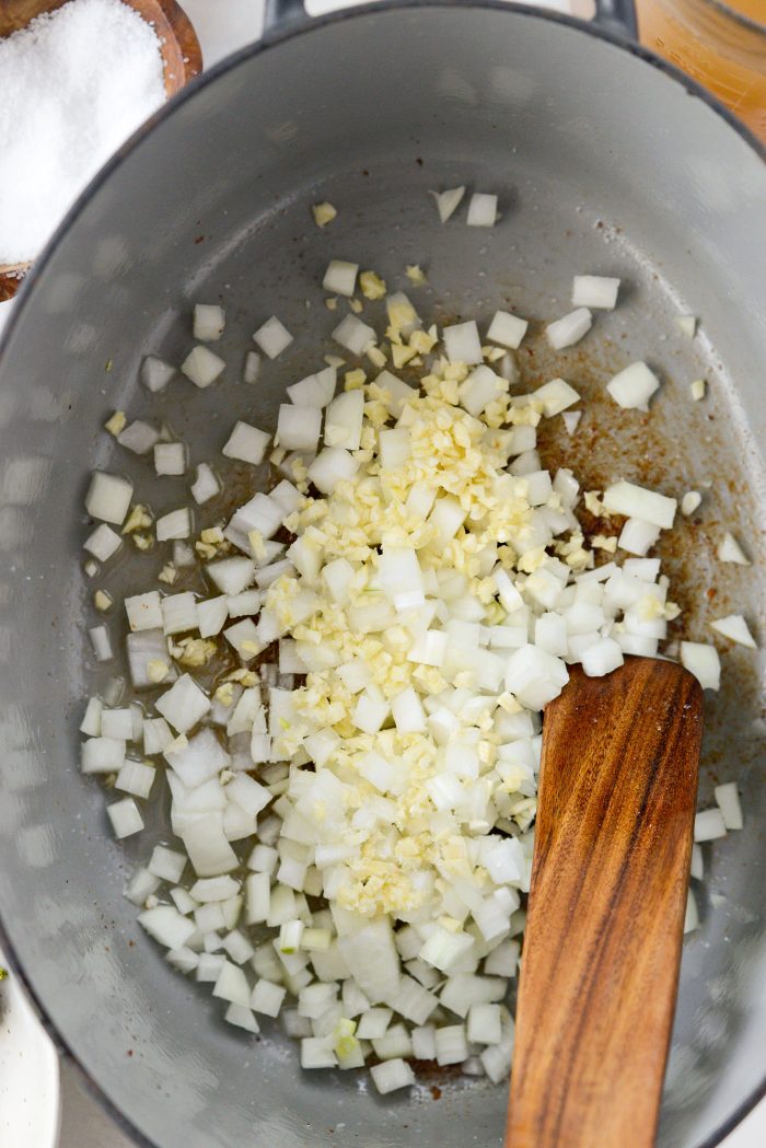 add onion and garlic to pot with bacon fat