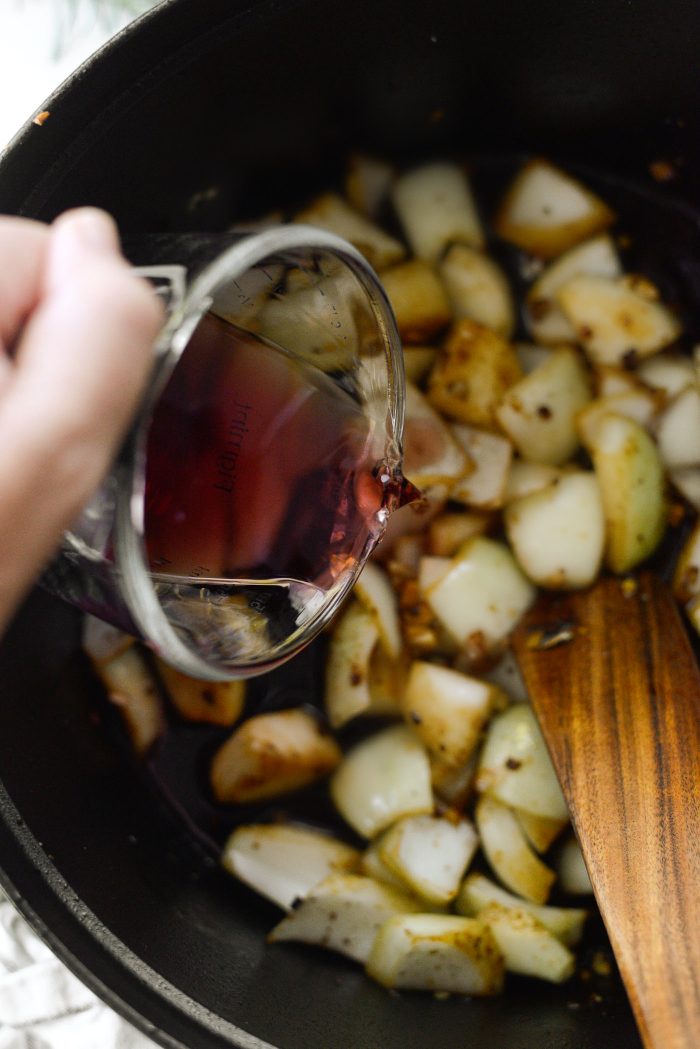 pour in wine and scrape bottom of pot