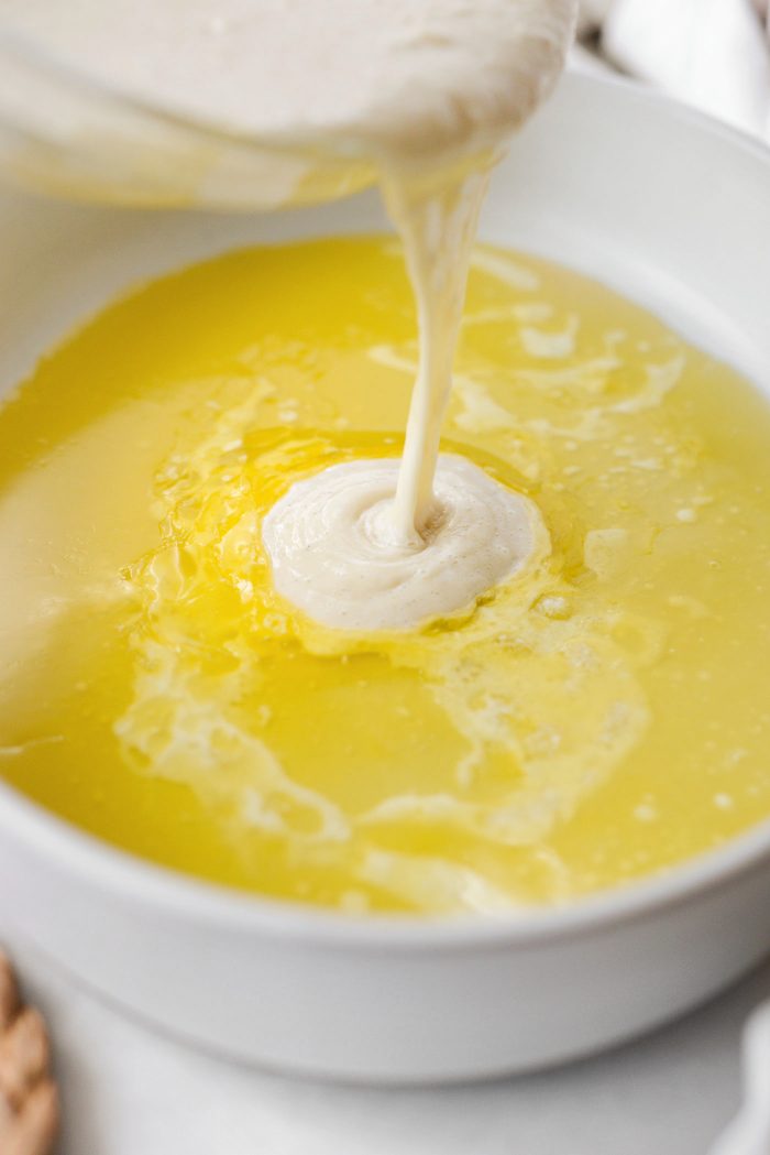 pour into pan with melted butter