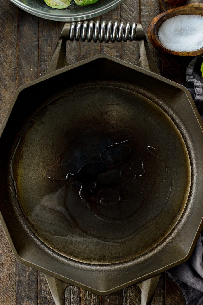 heat oil in large cast iron skillet