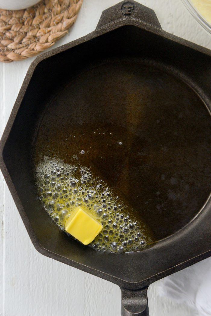 remove hot skillet from oven and add butter