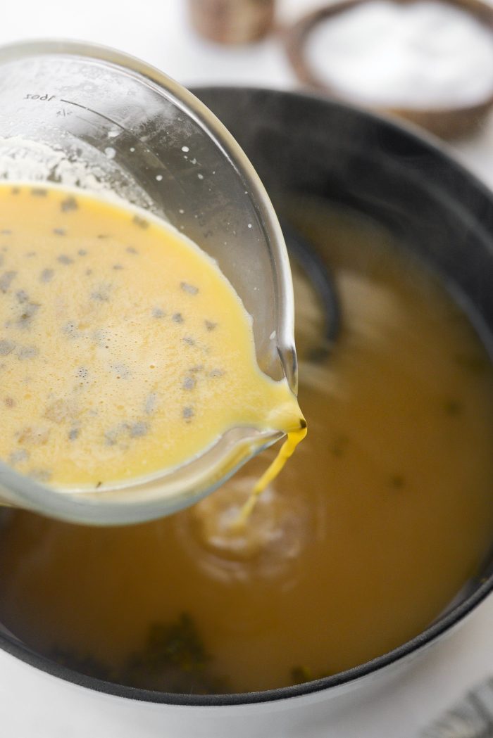 pour tempered eggs into soup