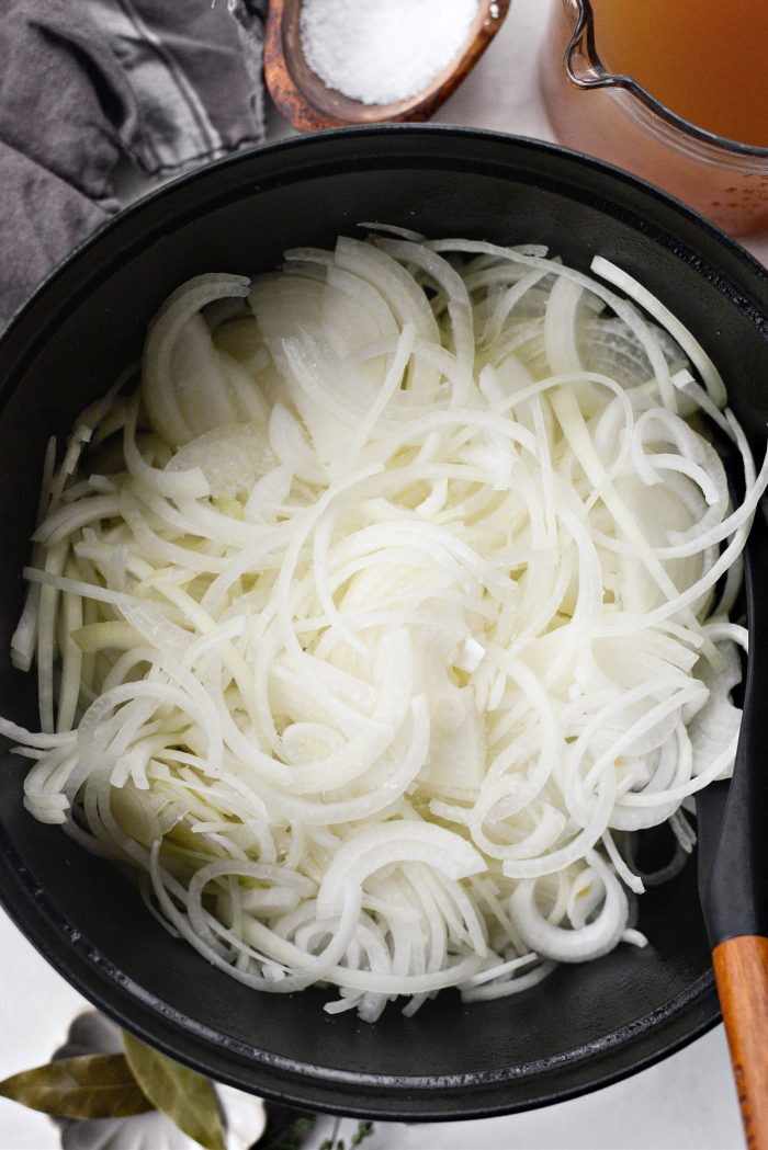 add sliced onions to pot