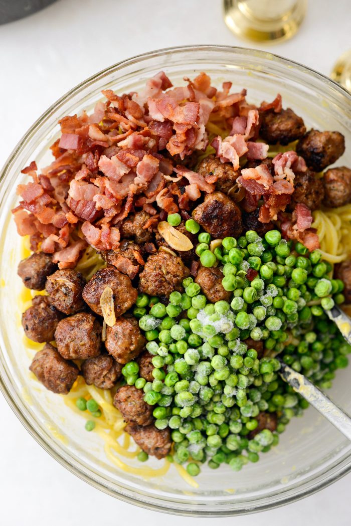 add in bacon, sausage and garlic and peas