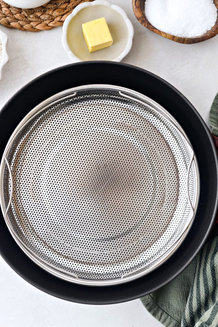 place steamer basket in pan of shallow water