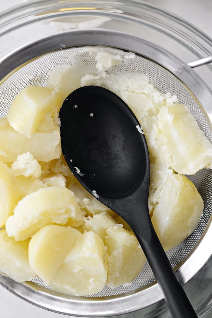 after 5 minutes, press potatoes through sieve with the back of a spoon